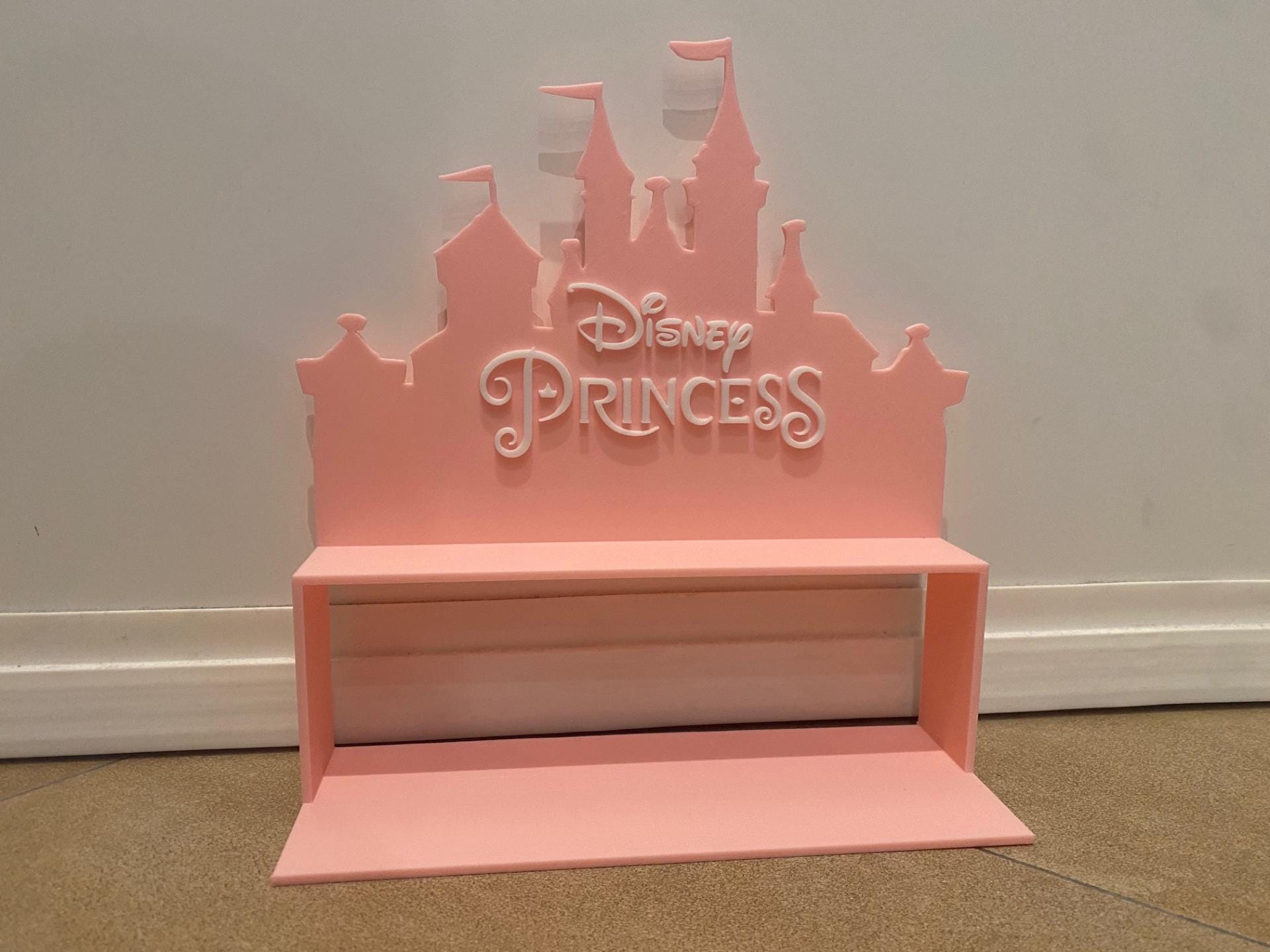 Disney shelf to hold mini princesses.