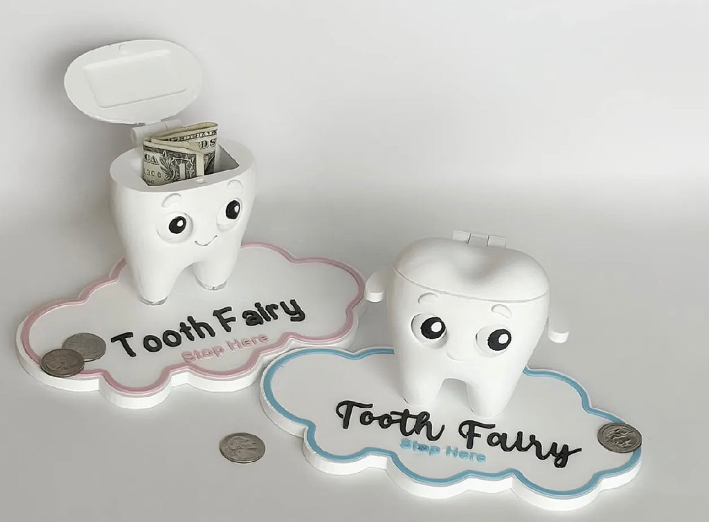 Tooth Fairy Buddy set — pink and blue versions with tooth boxes open showing coins and bills