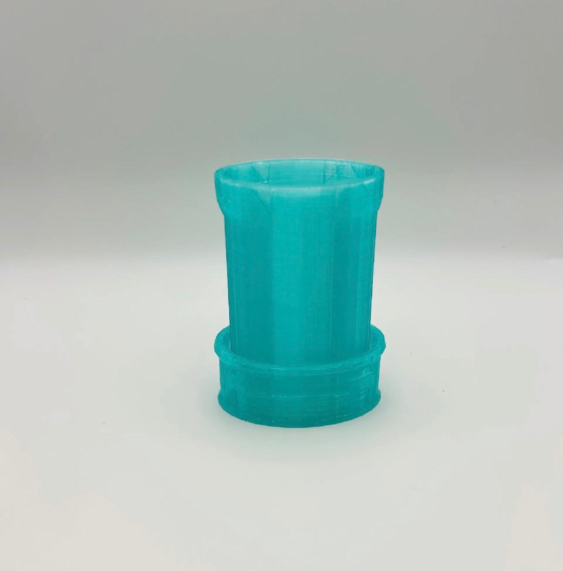 Single teal freeze pop holder — empty, showing ridged grip and wide base