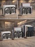 Three sizes of Tree of Life holders displayed on a wooden desk with books and papers