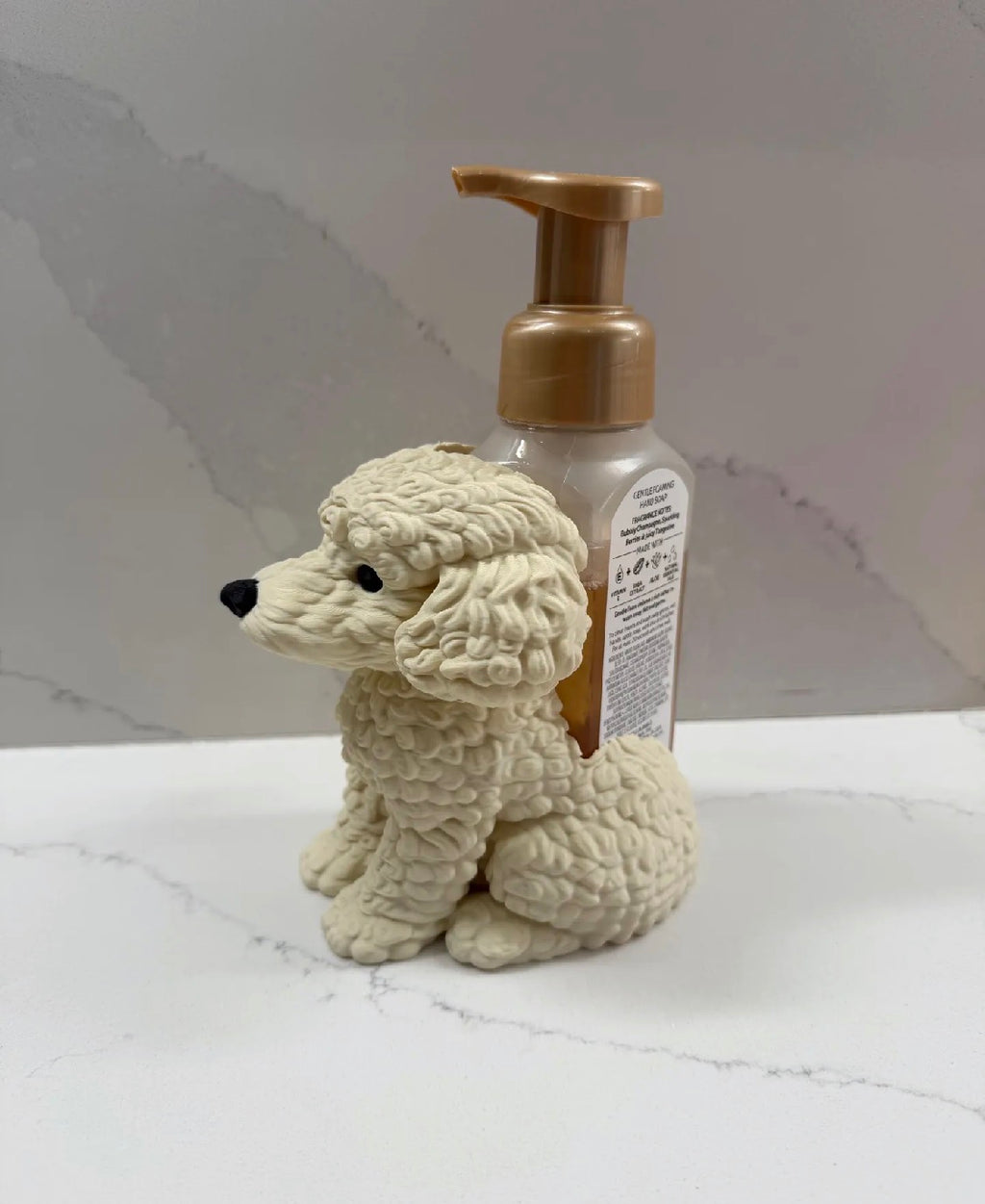 Curly dog soap dispenser holder side view with soap bottle