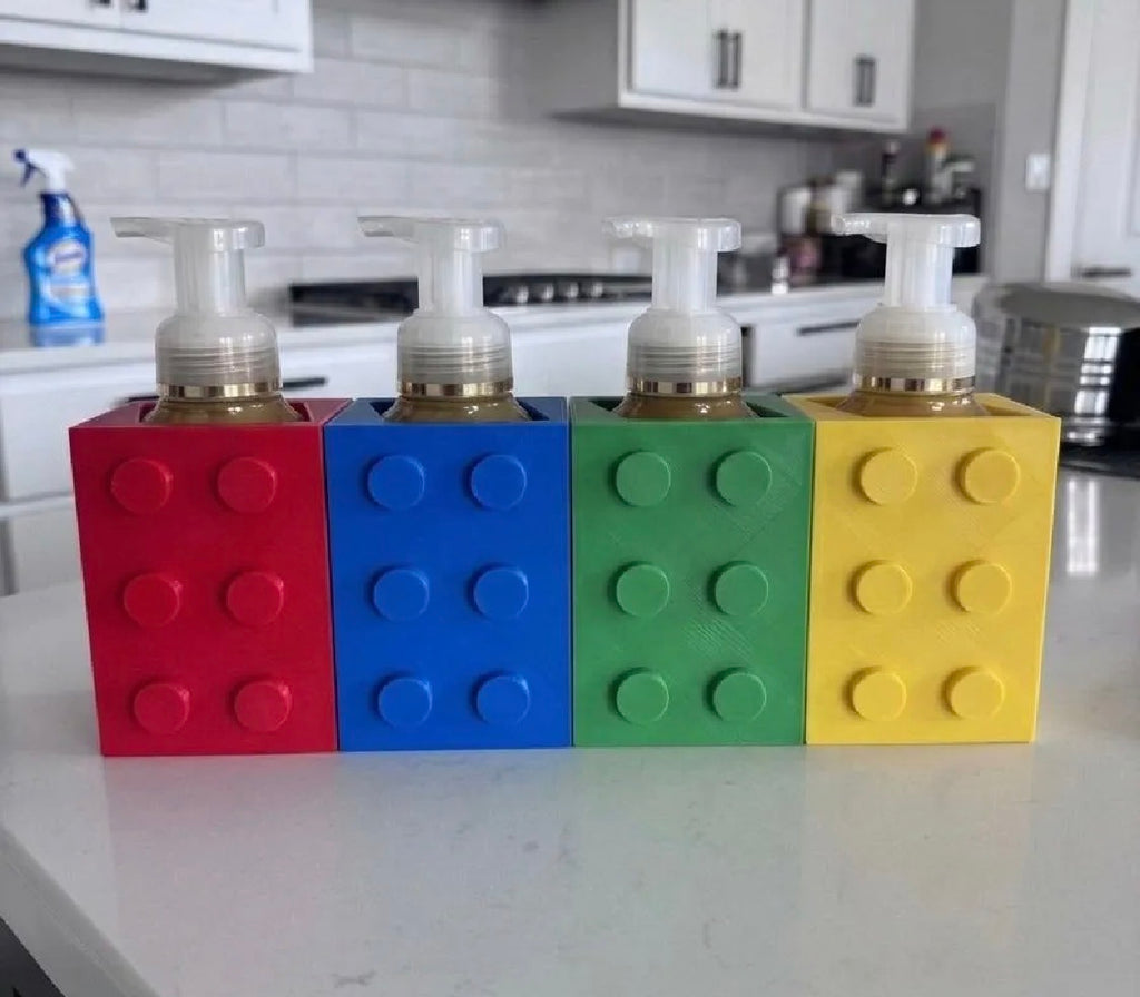 Building brick soap dispenser holders red blue green yellow set on counter