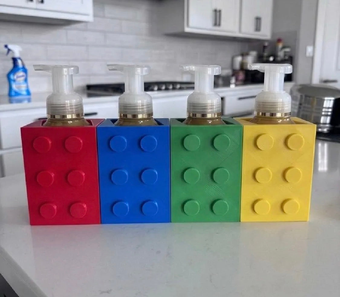 Building brick soap dispenser holders red blue green yellow set on counter