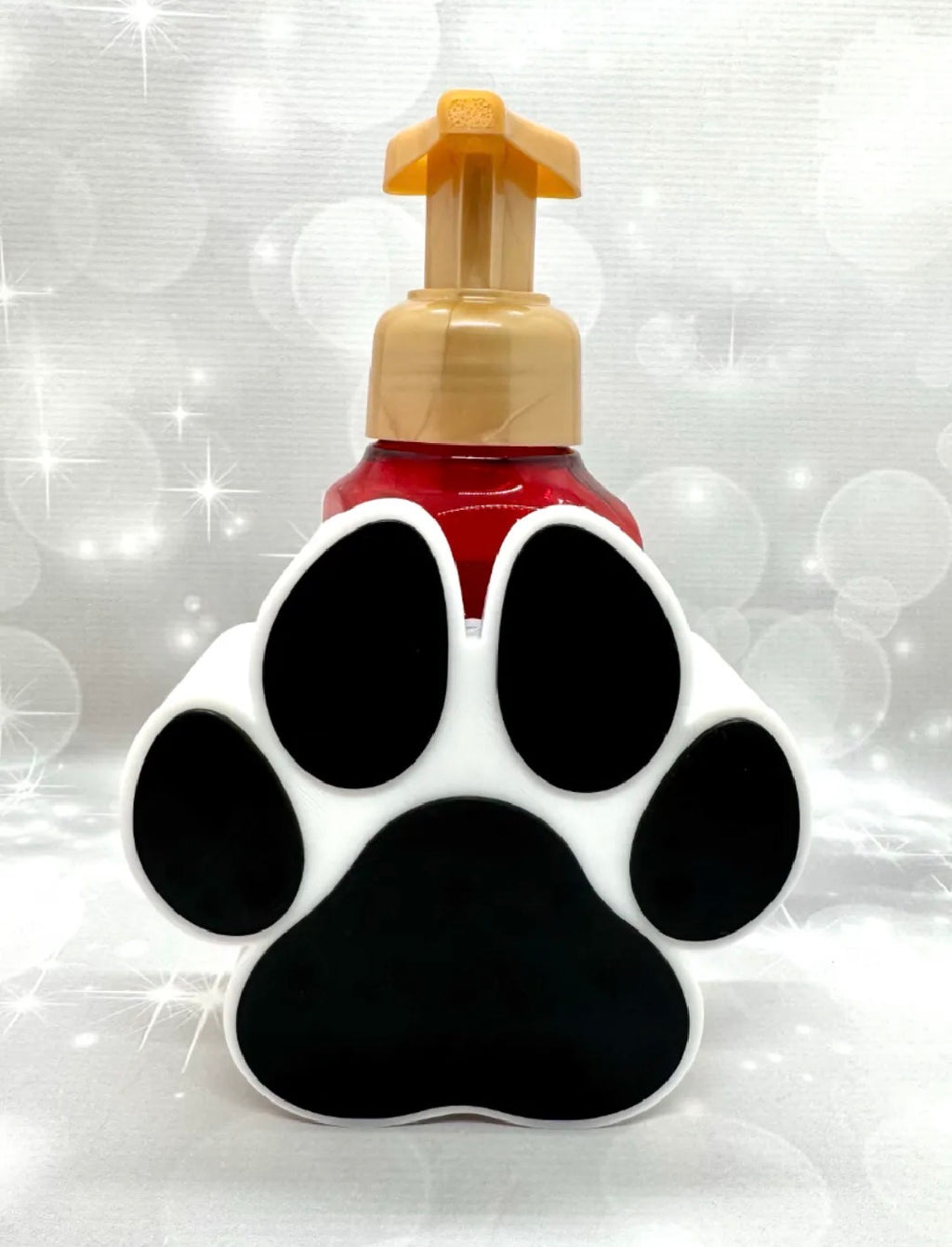 Paw print soap dispenser holder front view black and white
