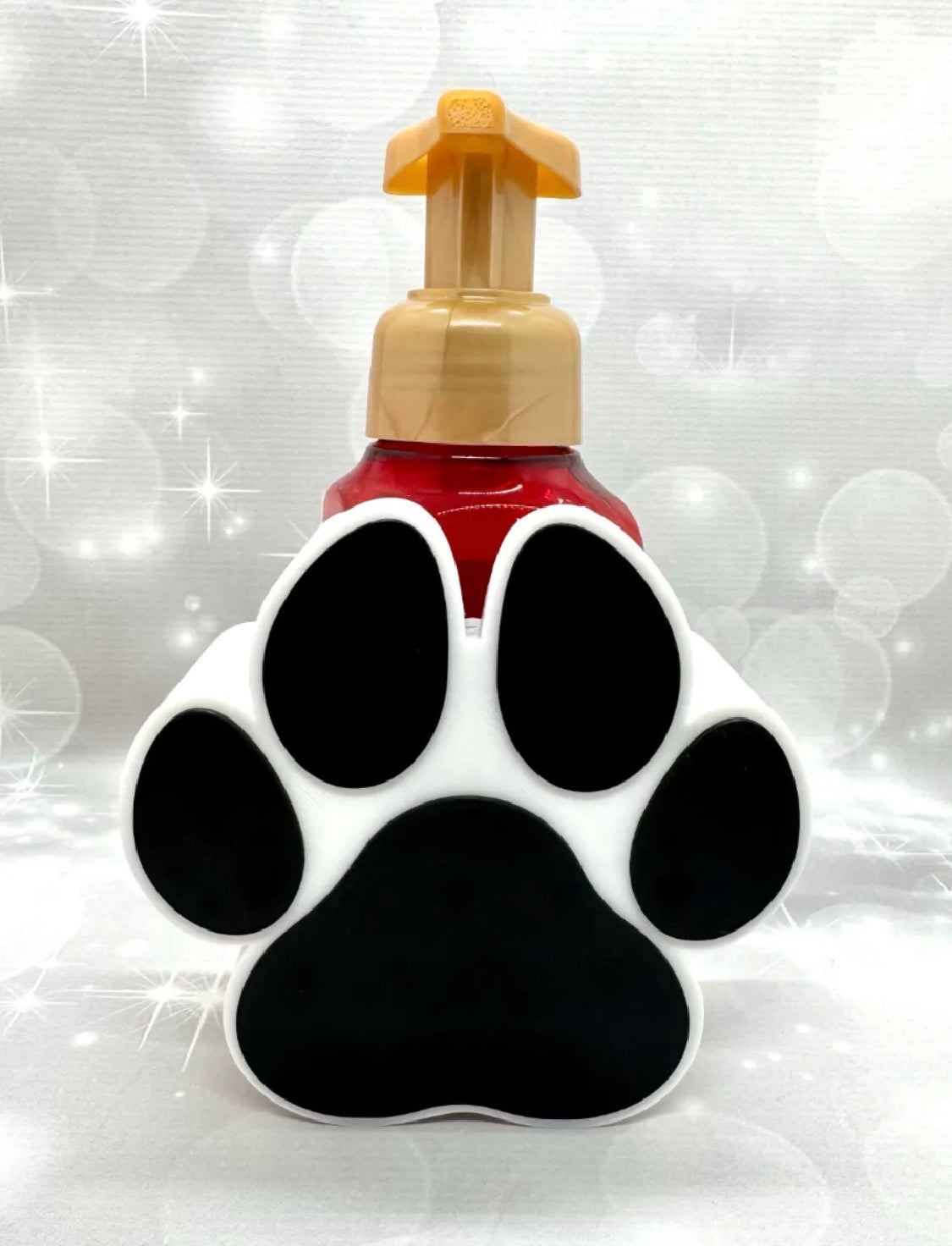 Paw print soap dispenser holder front view black and white