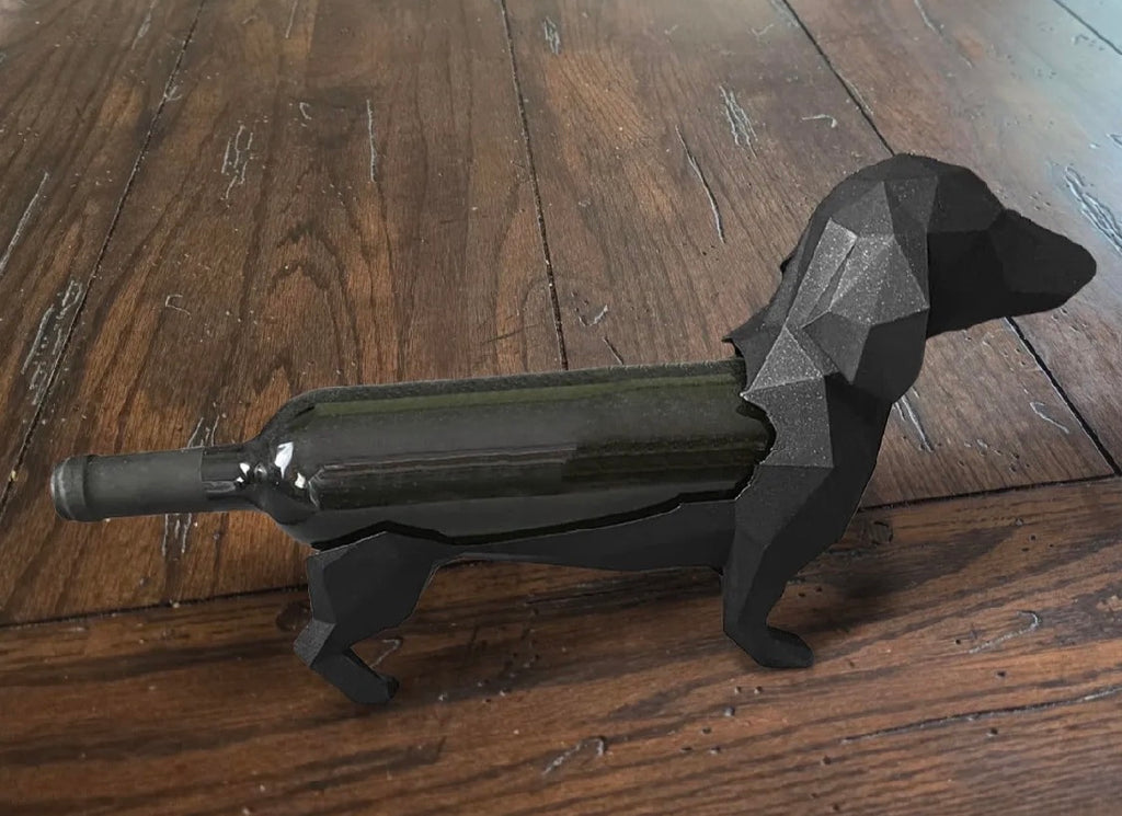 Dachshund wine bottle holder with wine bottle on wooden floor