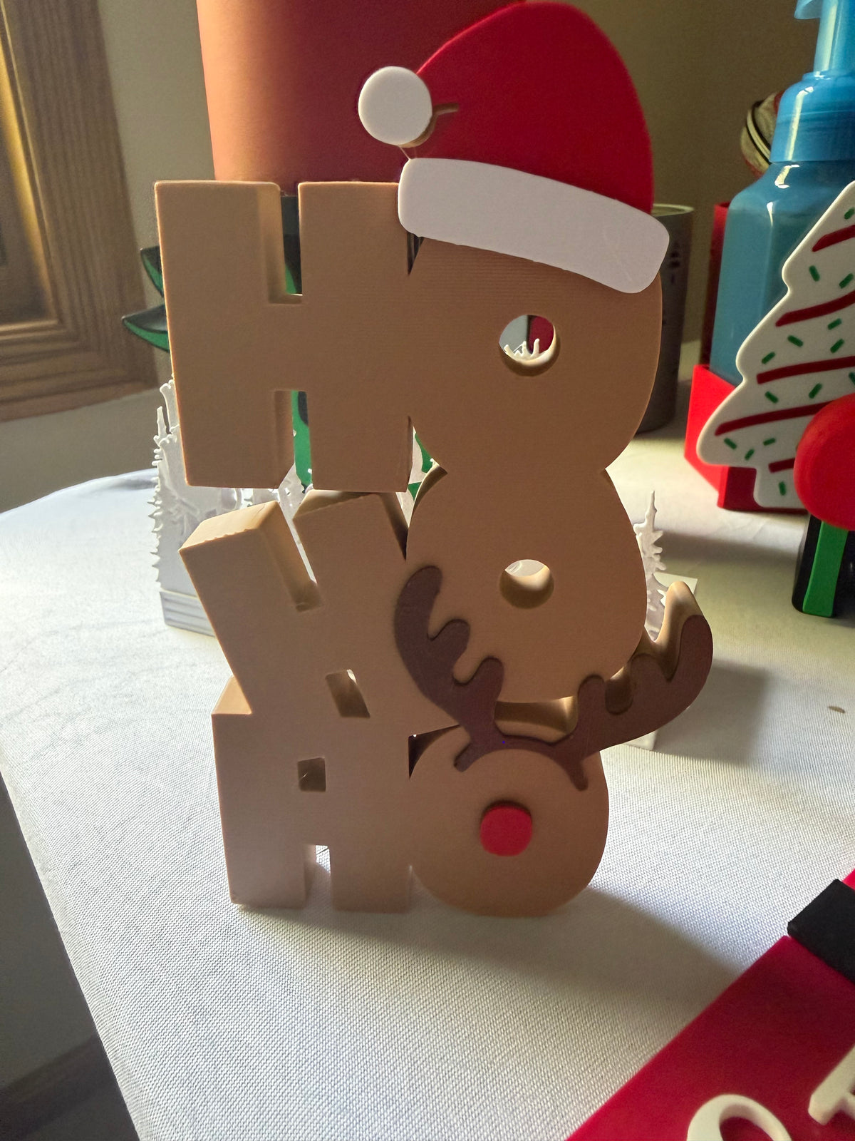 Front view of Ho Ho Ho Santa and reindeer Christmas tabletop sign