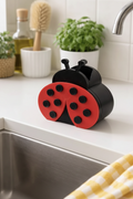 Ladybug soap holder lifestyle shot on white kitchen countertop