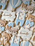 We Can Bearly Wait baby shower sugar cookies showing bear, onesie, carriage, hot air balloon, and cloud shapes
