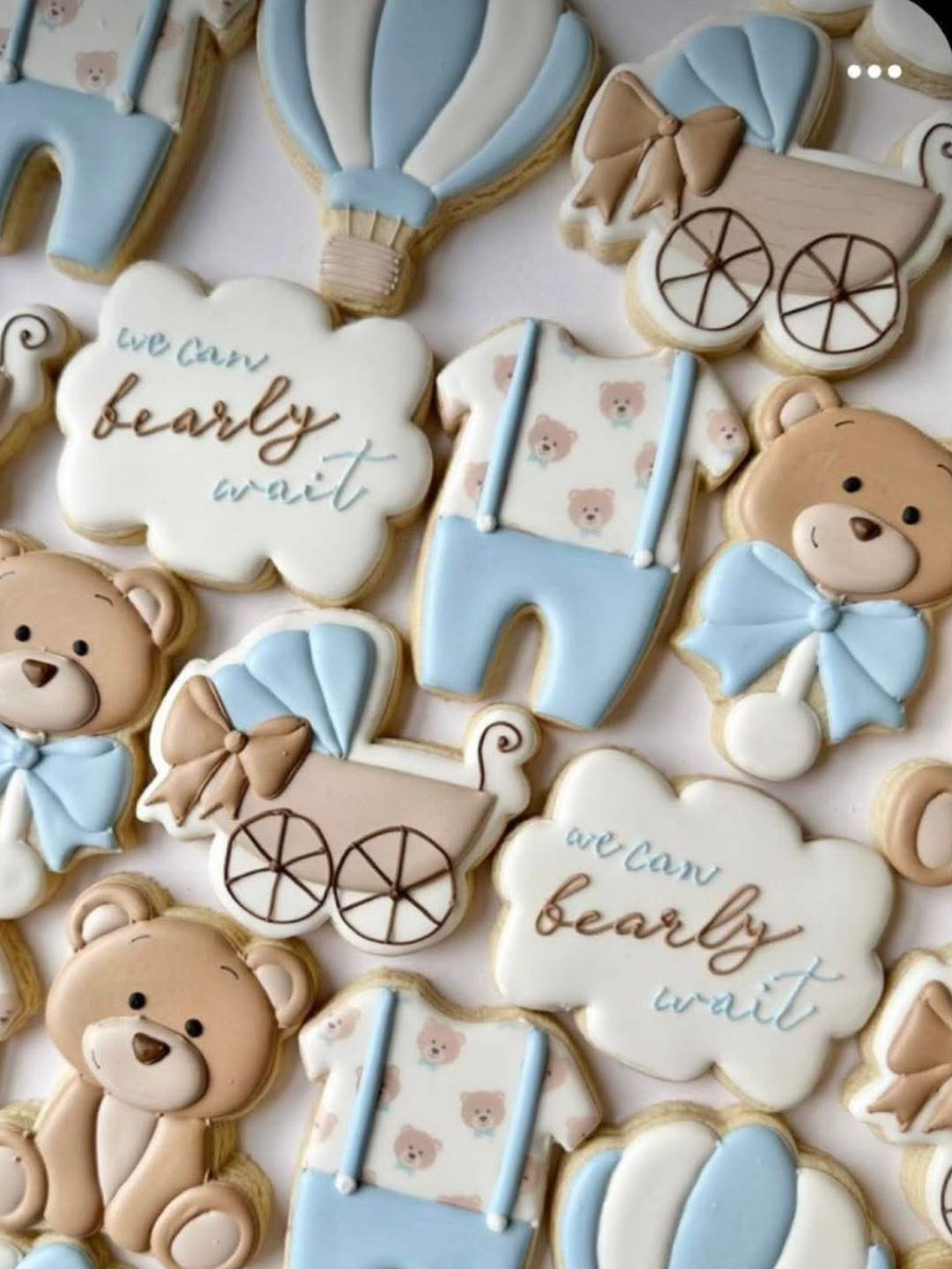 We Can Bearly Wait baby shower sugar cookies showing bear, onesie, carriage, hot air balloon, and cloud shapes