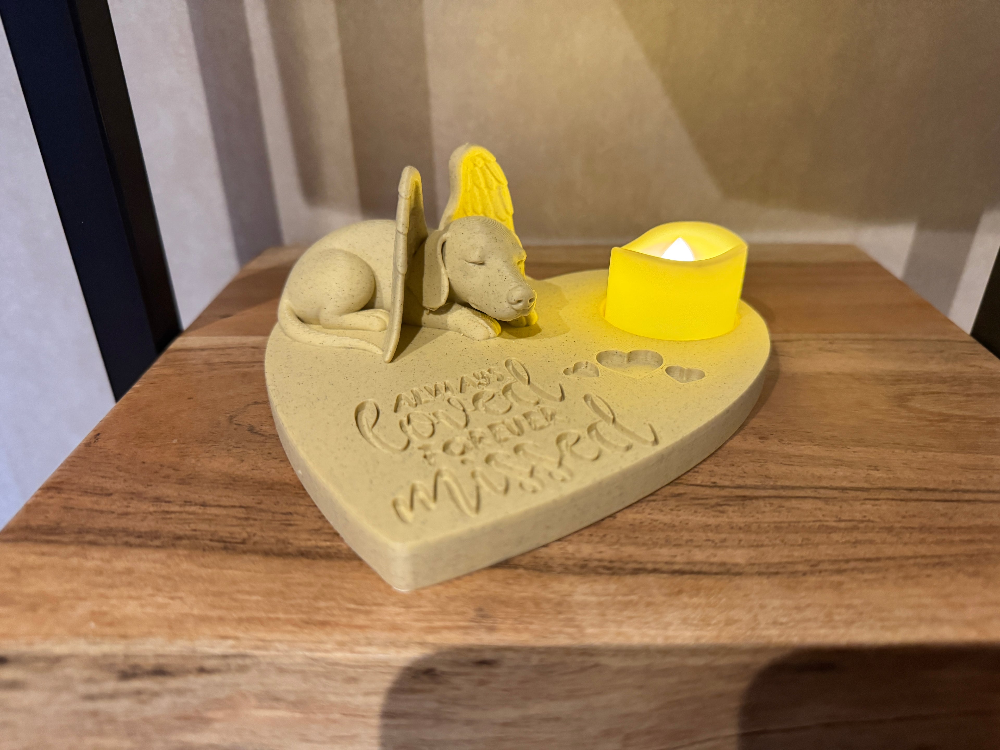 Dachshund angel memorial candle holder side view on wooden table