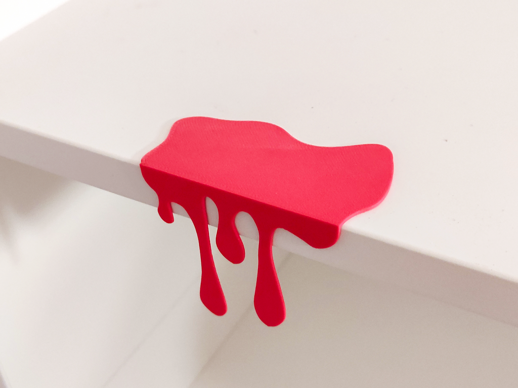 Red blood drip shelf decoration angled view showing clip-on design and drip detail