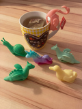 Yellow duck tea bag cup holder on mug rim