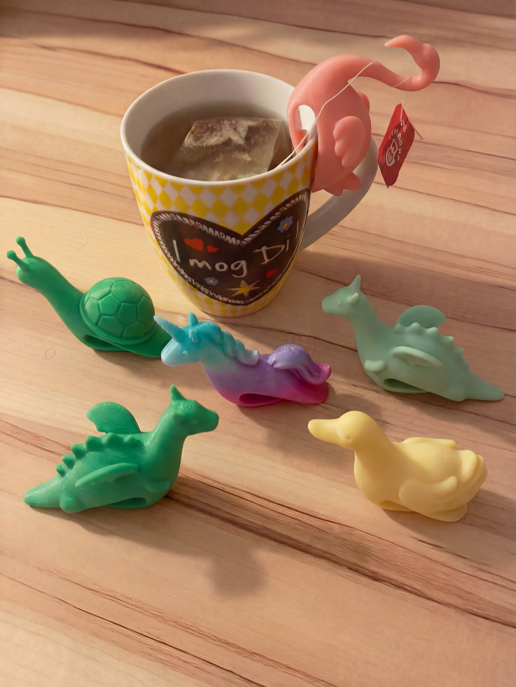 Yellow duck tea bag cup holder on mug rim