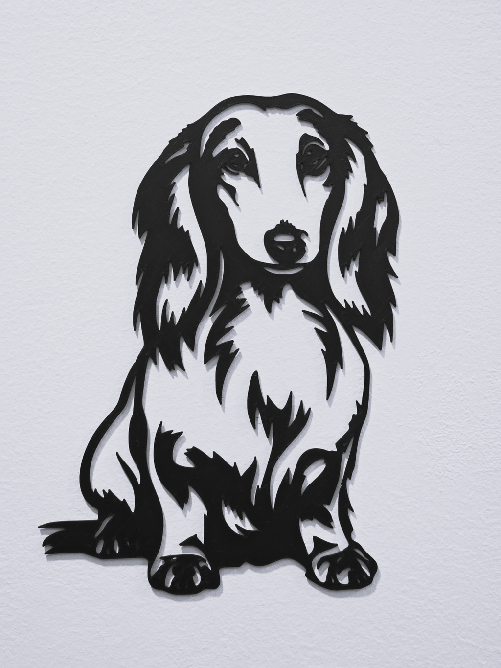 Long-haired dachshund wall art silhouette full view on white wall