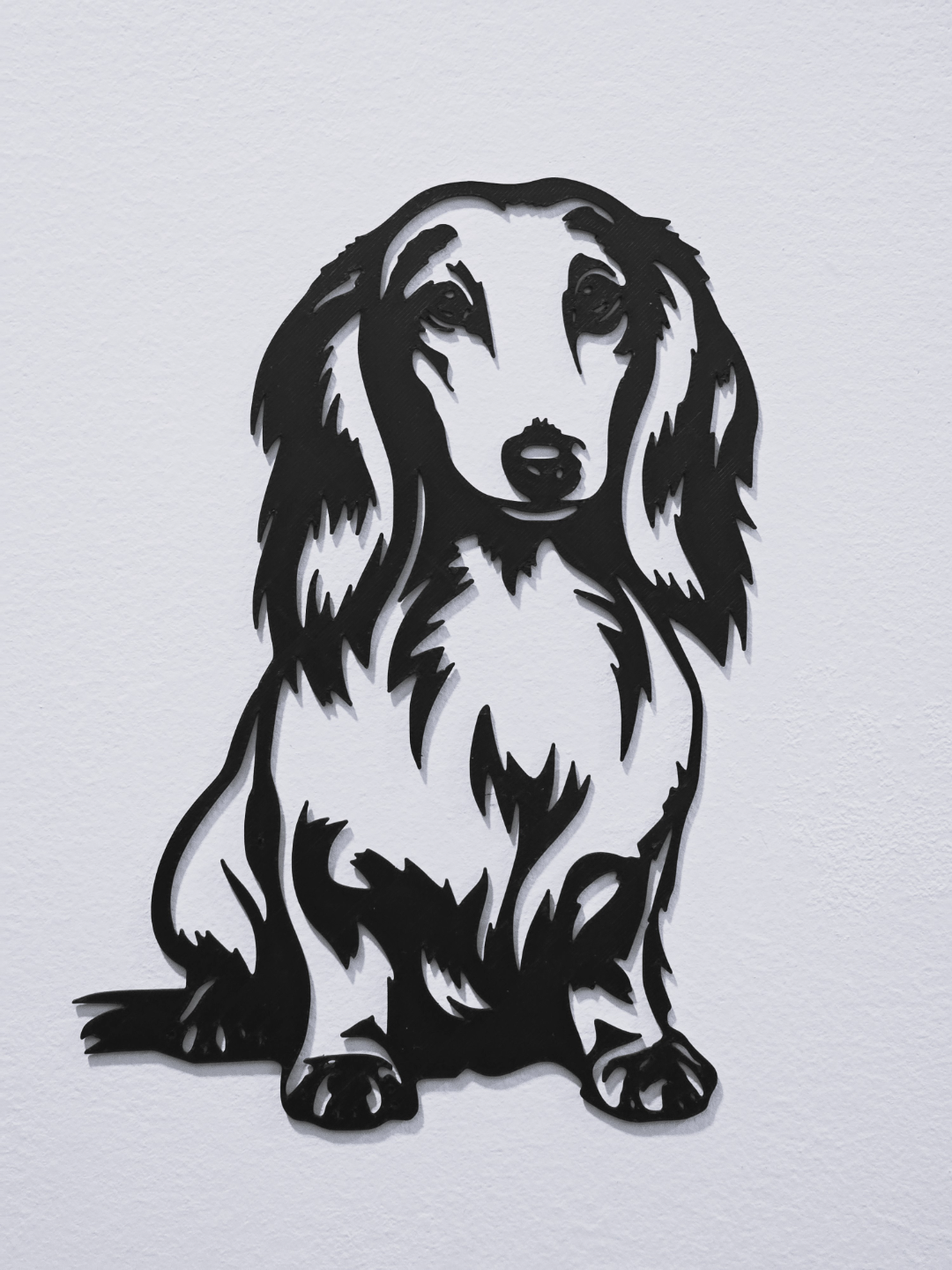 Long-haired dachshund wall art silhouette full view on white wall