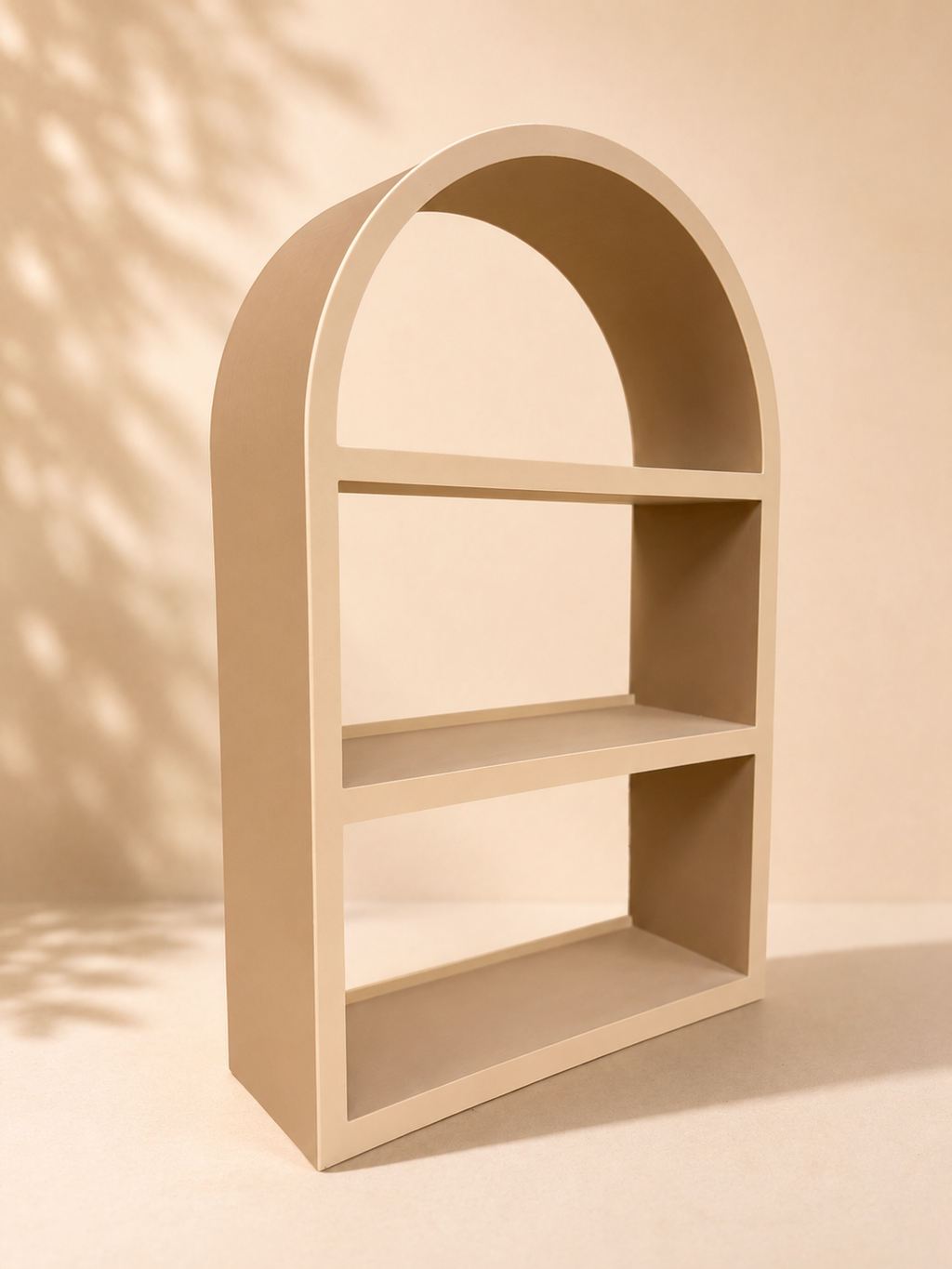 Arched 3-tier display shelf in warm beige angled side view