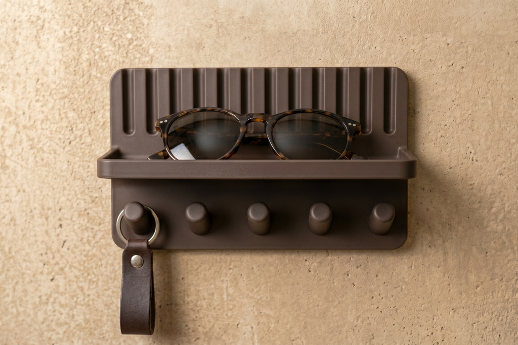 Entryway key holder shelf with 5 pegs and sunglasses on shelf tray, front view