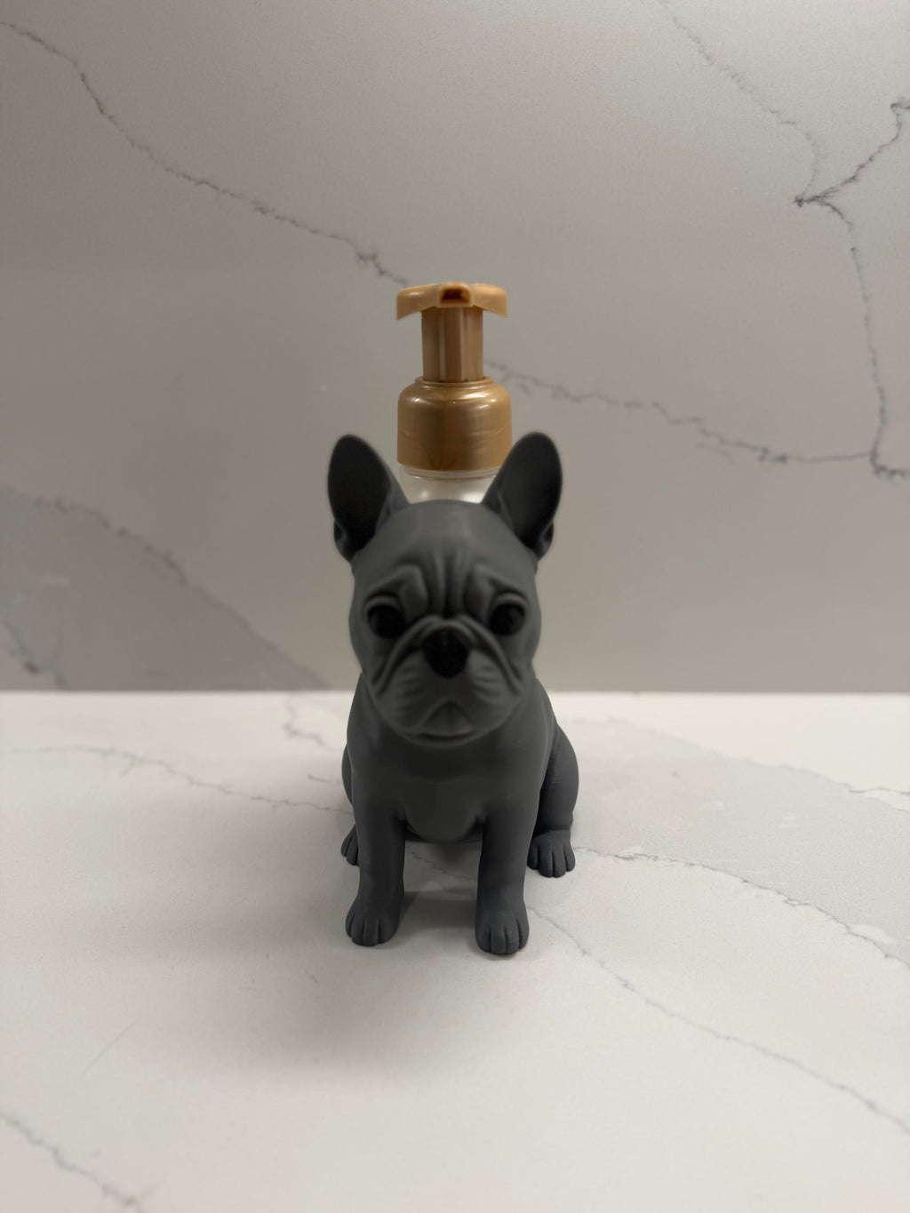 French bulldog soap dispenser holder front view full body on marble