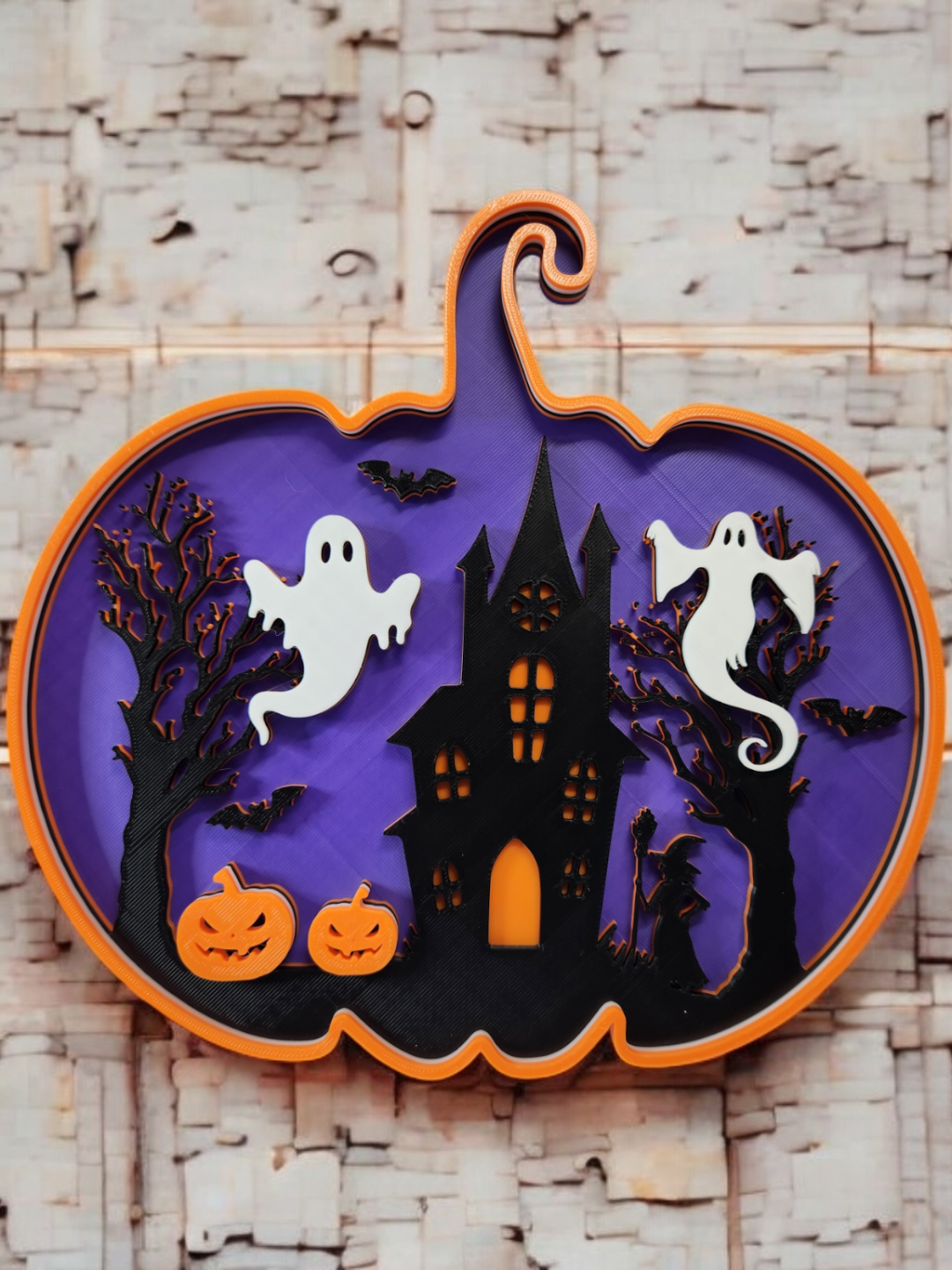 3D printed pumpkin shadow box with haunted house Halloween scene, front view on white background