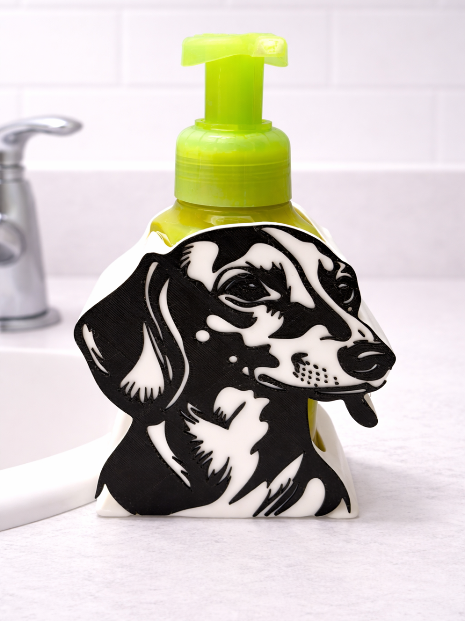 Dachshund soap dispenser holder on bathroom sink with green pump bottle